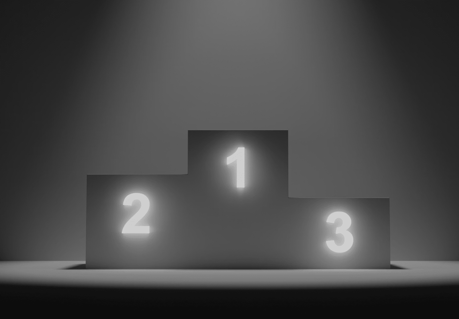 Three-tier winner's podium with the numbers 2 on the left, 1 on the center peak, and 3 on the right, illuminated by a soft spotlight against a dark gradient background.