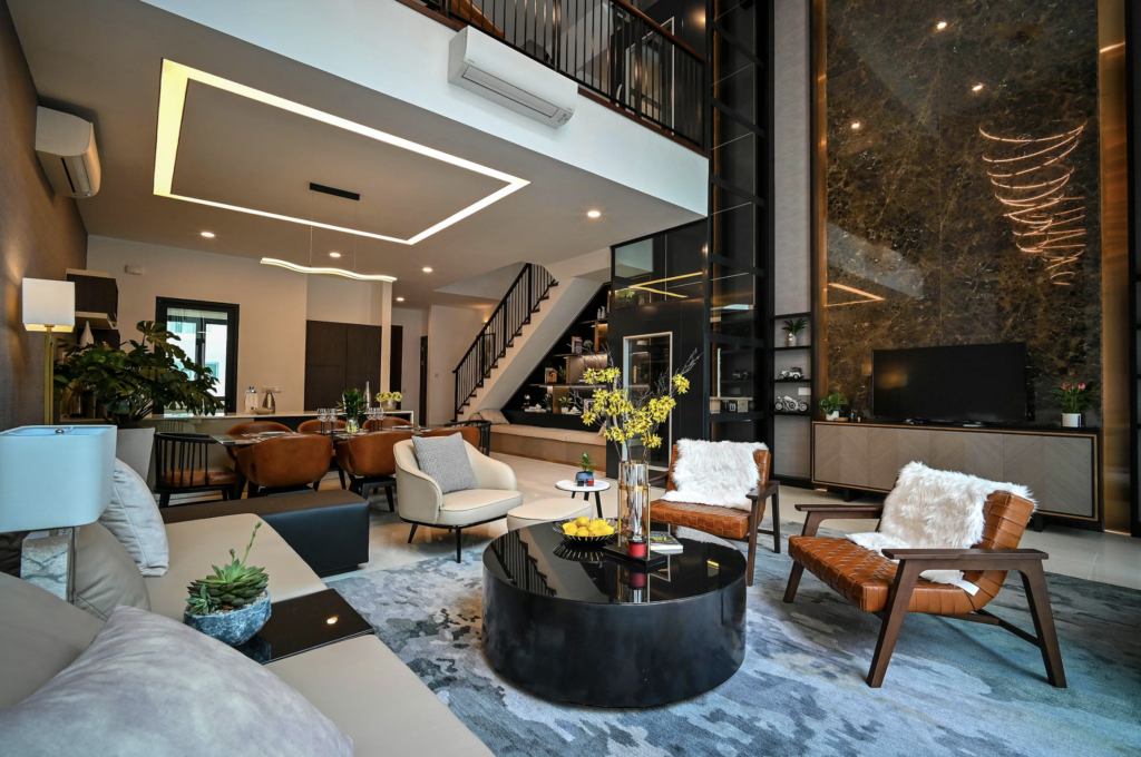 Luxurious open-plan living room with curved leather chairs, a black glossy coffee table, and a marble wall with warm lighting fixtures.